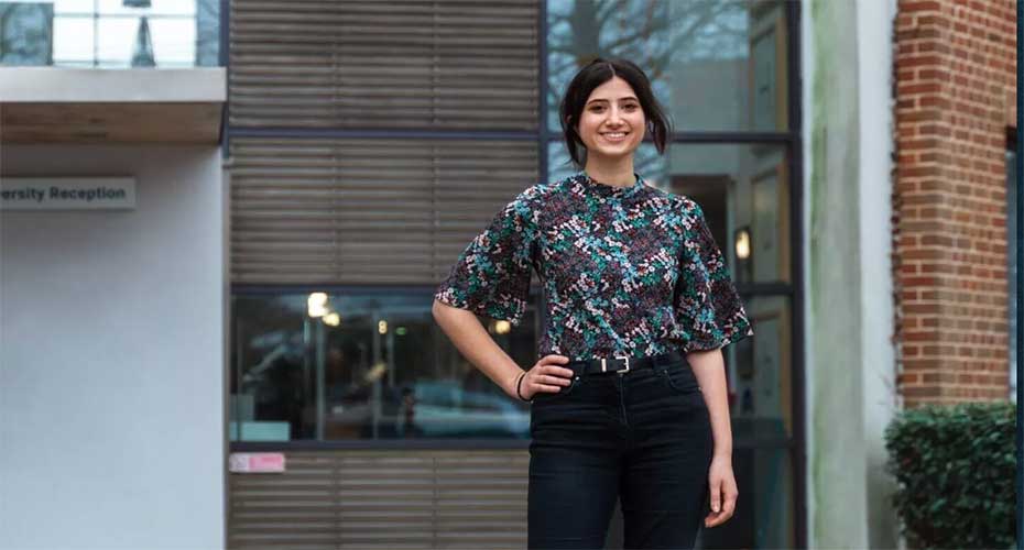 Roshana Wickremasinghe standing outside building